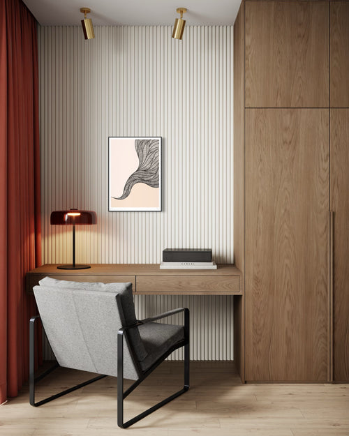 Modern home office with wooden desk, chair, lamp, and wall art.