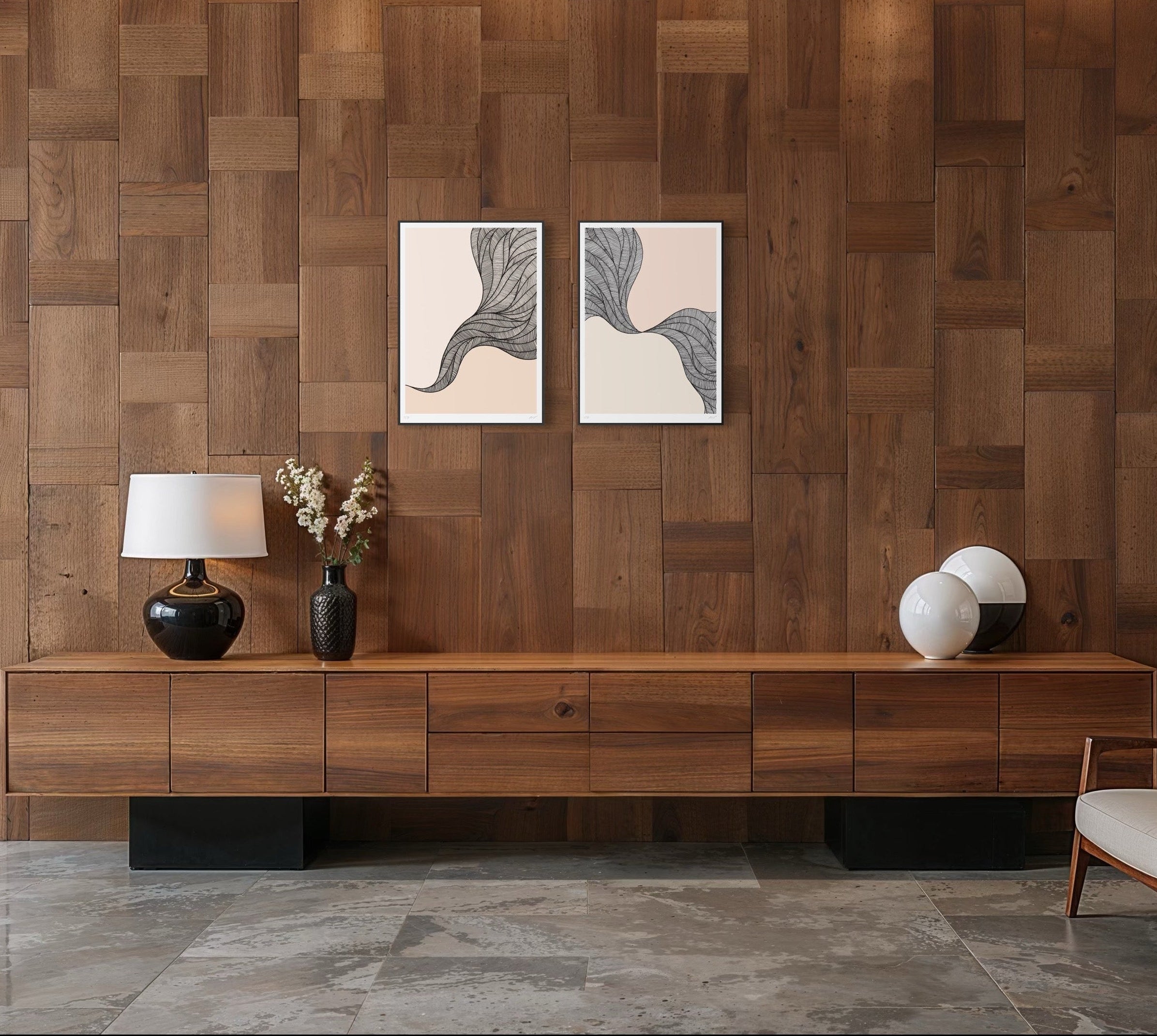 Wooden wall with two abstract paintings, a lamp, and decorative items.