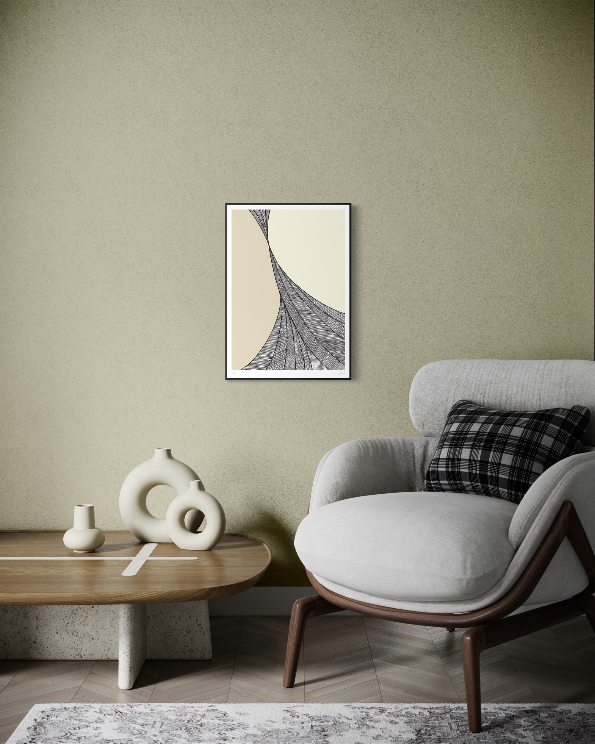 Modern living room with a gray armchair, wooden coffee table, and abstract art on the wall.